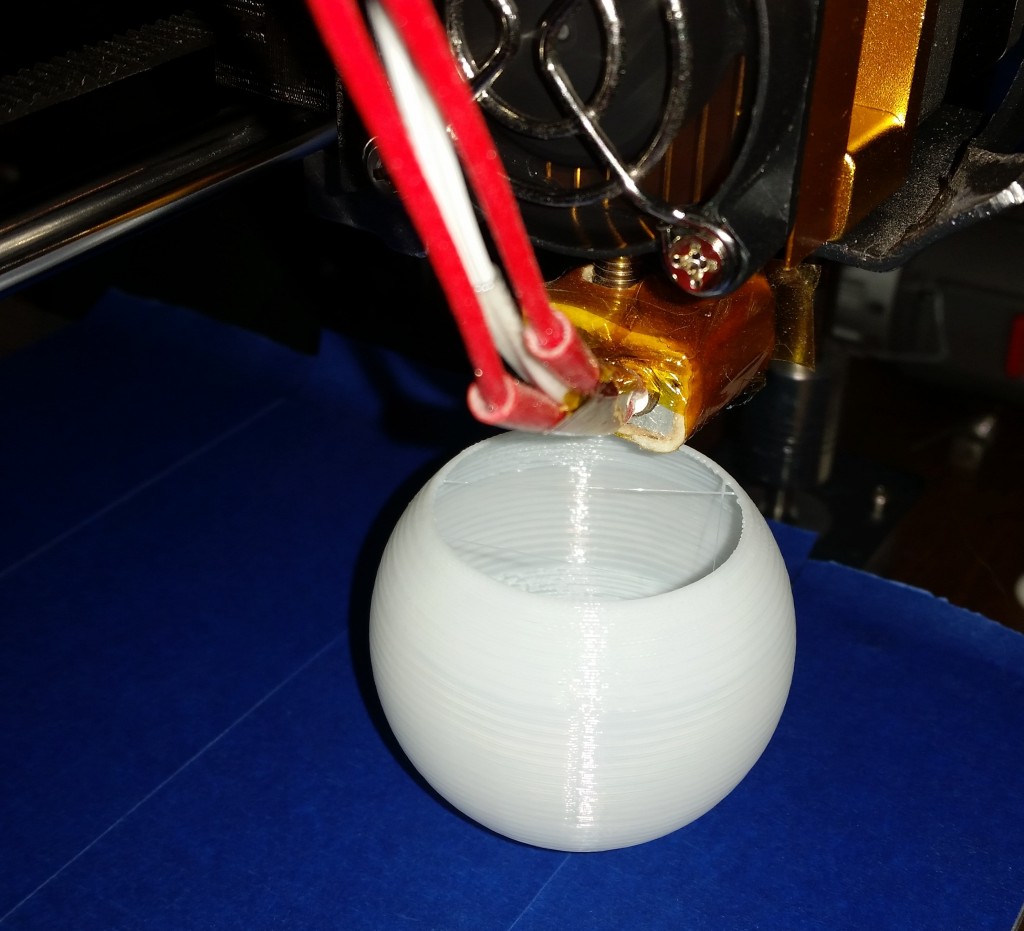 My Hictop Prusa i3 clone 3D printer making a thin sphere.